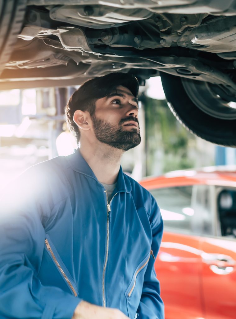 Mechanic checking under a vehicle - Book an MOT online with Leigh MOT Service & Repair Centre