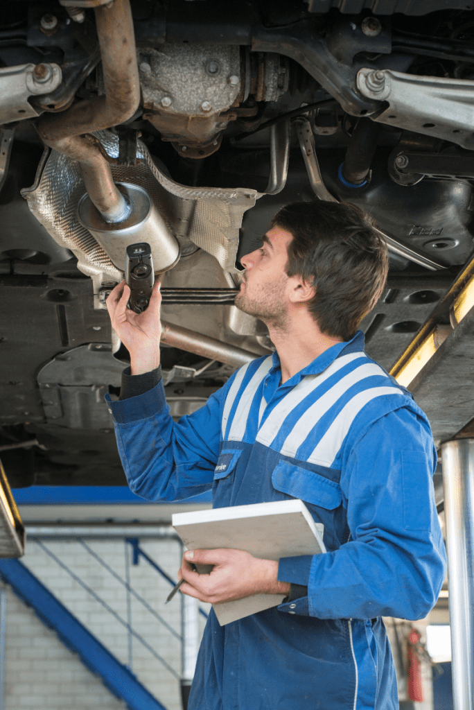 Mechanic inspecting a vehicle - Female-Friendly Service at Leigh MOT Service & Repair Centre